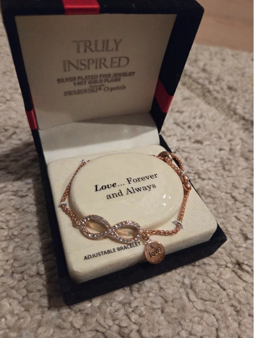 Adjustable rose-gold-plated infinity charm bracelet